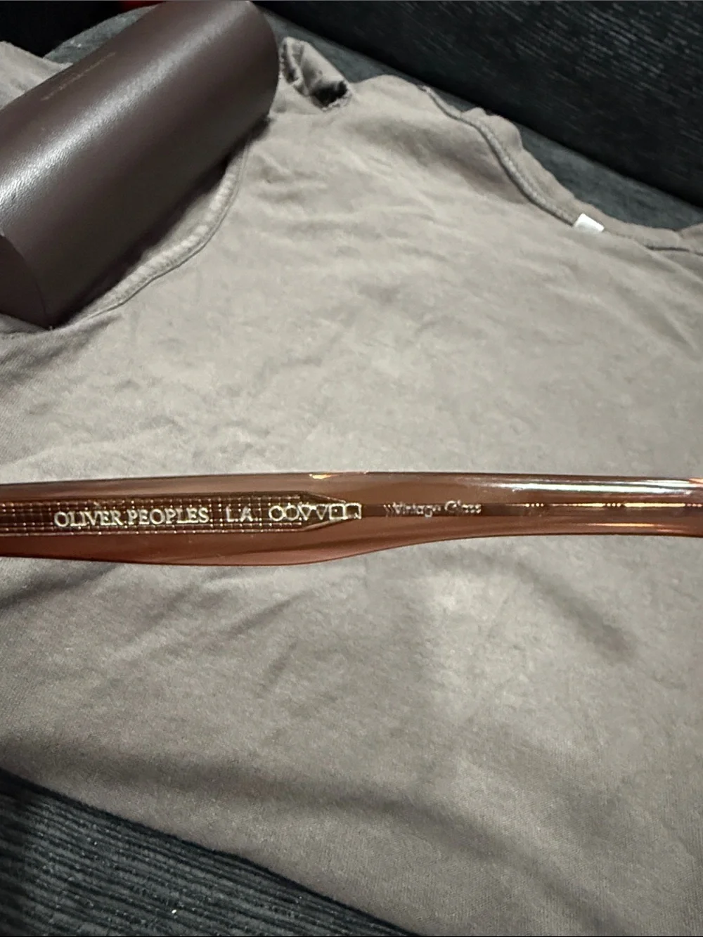 Oliver Peoples Brown Transparent Frame Sunglasses with Brown Lenses.